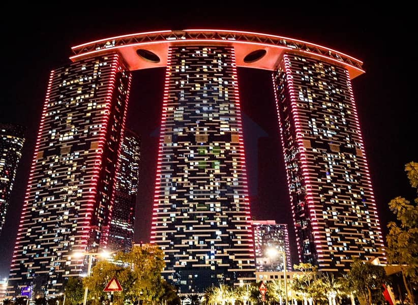 2 Abu-Dhabi’s-iconic-Gate-Towers-in-Al-Reem-Island-light-up-in-red-to-celebrate-the-entry-of-the-Hope-Probe-to-the-Mars-orbit-2. jpg