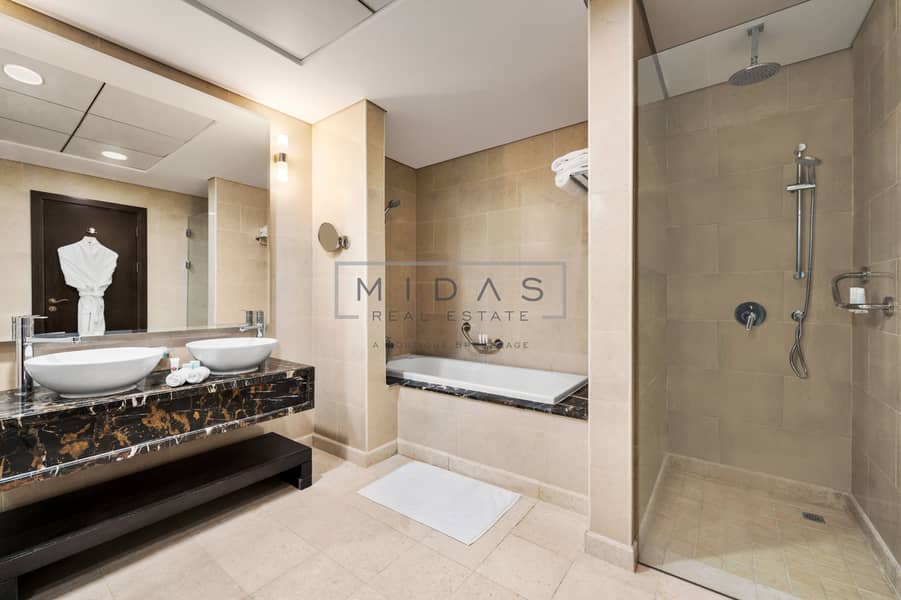 7 Bathroom with bathtub and walk in shower. jpg