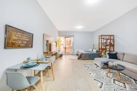 Studio for Sale in Jumeirah Village Circle (JVC), Dubai - Vacant | Corner | Furnished | Upgraded | Pool View