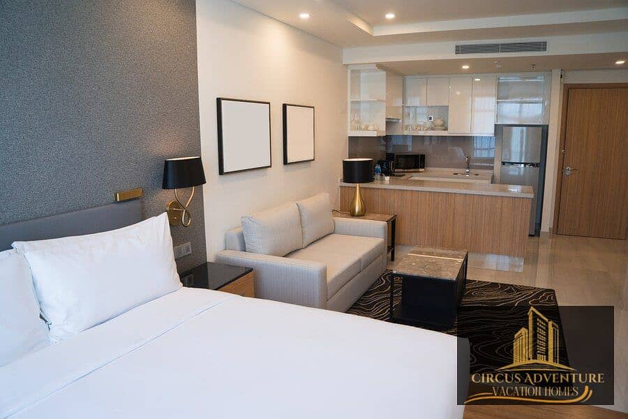 2 hotel-room-interior-with-bedroom-area-living-space-kitchen_1262-12288. jpg