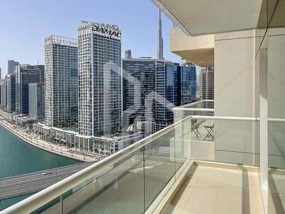 1 Bedroom Flat for Rent in Business Bay, Dubai - Canal and Burj Khalifa View | High Floor | Kitchen Equipped