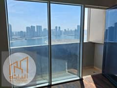 For rent: An apartment with two bedrooms, a living room, and a maid's room, offering a sea view in Beach Tower 1, for 55,000 AED.