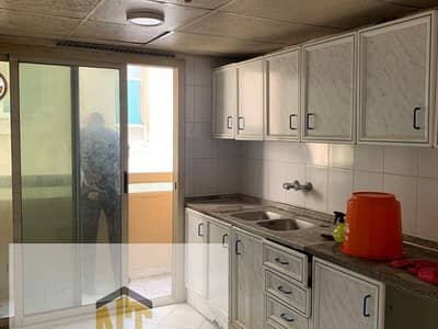 1 Bedroom Flat for Rent in Bu Tina, Sharjah - 1 BHK Apartment with Balcony & Free Parking for Rent in Al Butina – Sharjah | Prime Central Location Near All Amenities