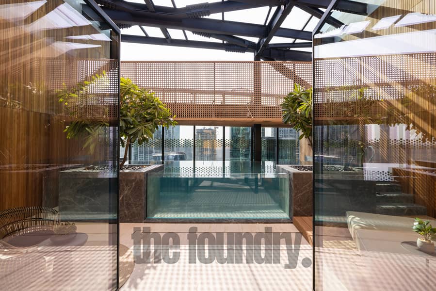 11 The OPUS Penthouse by OMNIYAT Pool & Sundeck. jpg
