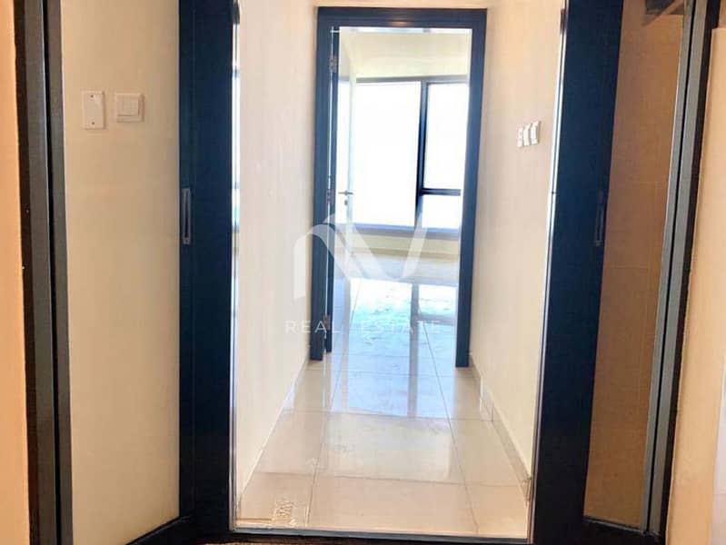 5 Sun Tower 2BR, Al Reem Island - 177968314612_0007_remove 10. jpg