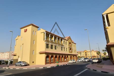 Shop for Rent in International City, Dubai - spain-cluster-23880_xl (1). jpg