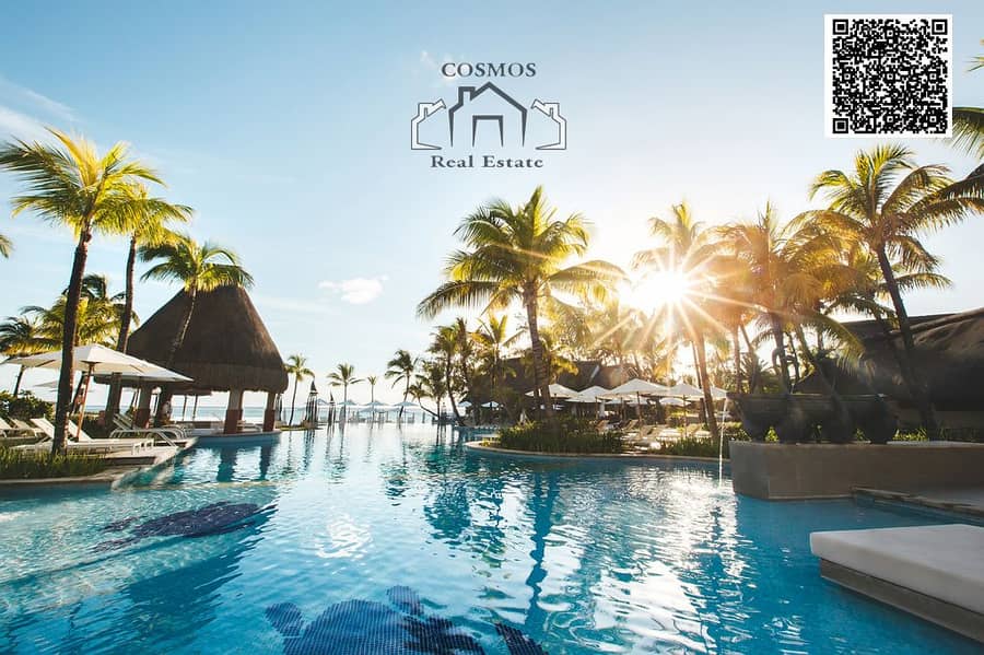 16 swimming-pool-among-palm-trees-on-a-tropical-islan-2022-02-12-05-47-40-utc. jpg