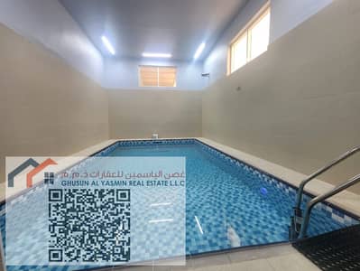 For rent a villa in Al Zahya, furnished, five rooms, a hall, a swimming pool, a maids room, and a roof. Required: 170,000 + a check deposit of 10,000