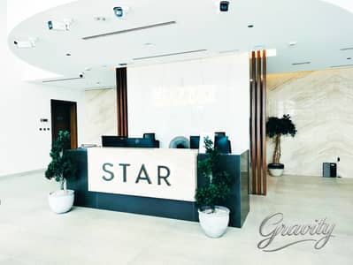 استوديو  للايجار في الفرجان، دبي - azizi star png reception. png