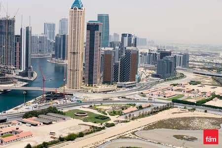 2 Bedroom Apartment for Sale in Business Bay, Dubai - High Floor | Brand New | Vacant | Canal View
