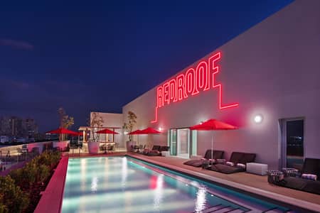 2 Bedroom Hotel Apartment for Rent in Dubai Silicon Oasis (DSO), Dubai - Pool Night. jpg