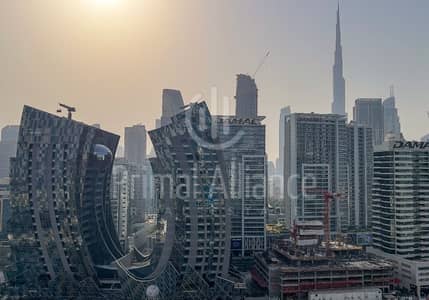 2 Bedroom Flat for Rent in Business Bay, Dubai - Furnished | Burj Khalifa and Canal View | Close Kitchen