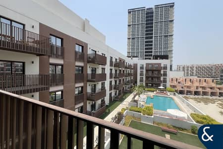 1 Bedroom Apartment for Rent in Jumeirah Village Circle (JVC), Dubai - Unfurnished | Utility Room |Vacant |Pool View