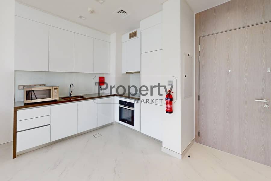 7 U-2315-MBR-City-Residences-13-District-One-1BR-Kitchen. jpg