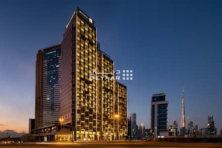 Hotel Apartment for Rent in Business Bay, Dubai - Millennium Atria dusk. png