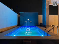 A luxury villa with a swimming pool at Ajman, high-end finishing, modern design, including registration and ownership