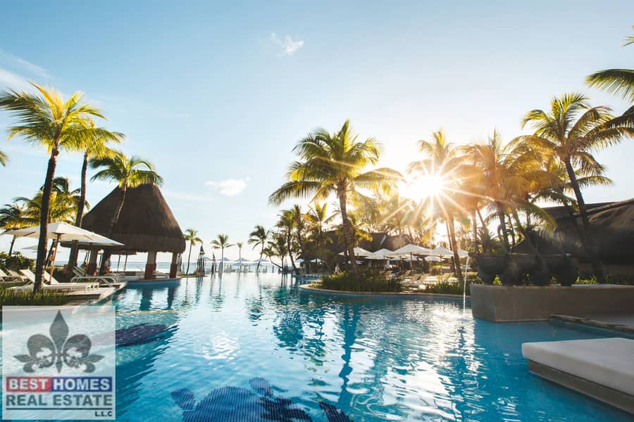 5 swimming-pool-among-palm-trees-on-a-tropical-islan-2022-02-12-05-47-40-utc. jpg