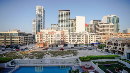 2 Bedroom Apartment for Sale in Jumeirah Village Circle (JVC), Dubai - Luxurious 2BR | Rented | Pool View