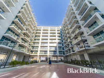 1 Bedroom Flat for Rent in Dubai Studio City, Dubai - Garden View|Bright Layout 1BR|Kitchen appliances