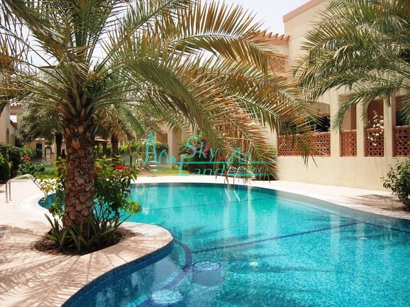ABSOLUTELY AMAZING 5BR+MAID'S VILLA WITH GARDEN IN A COMPOUND WITH POOL