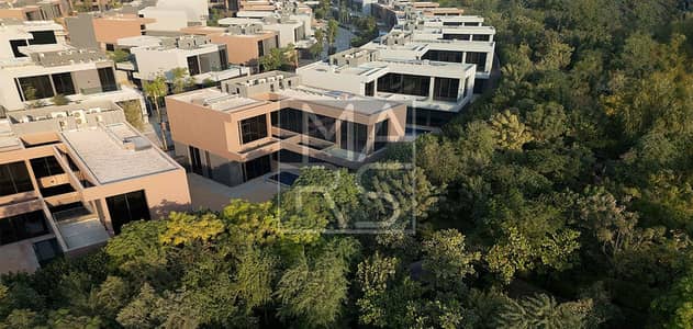 蒂拉尔城， 夏尔迦 2 卧室联排别墅待售 - 430-homes-have-been-completed-in-the-first-phase-of-Masaar-2. jpg