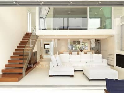 2 Bedroom Townhouse for Sale in Tilal City, Sharjah - 1691467772_en-idei-club-p-modern-high-ceiling-living-room-with-stair-78. jpg