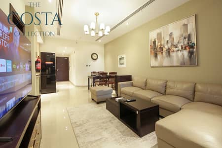 1 Bedroom Flat for Rent in Downtown Dubai, Dubai - A LIVINGROOM (1). jpg