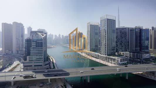2 Cпальни Апартамент Продажа в Бизнес Бей, Дубай - 03 - Burj Khalif and Canal View from Balcony. JPG