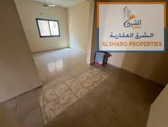 Two rooms and a hall for annual rent in Ajman Corniche, large area with a balcony and 2 bathrooms, a very distinguished location and on the main stree