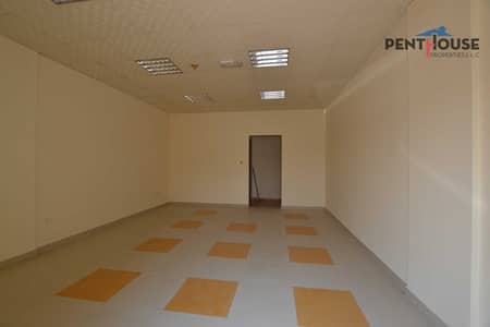Shop for Rent in International City, Dubai - Close to Bus Stop | Big Layout | Parking Side