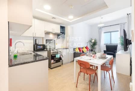 2 Bedroom Flat for Rent in Wasl Gate, Dubai - Living room (2). jpg