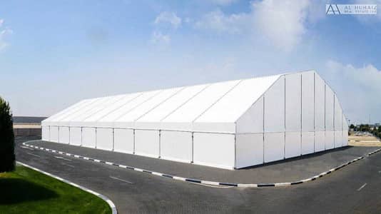 Warehouse for Rent in Dubai Industrial City, Dubai - 30 PSF COVERED OPTIONS 20,000-100,000 SQ. FT.