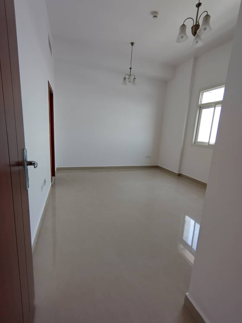 1 bhk available good for family sharing allowed near Al muteena Rood Brand New building Rent 53k with car parking available and also central gas available with balcony