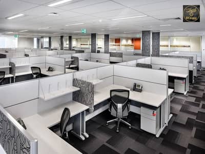 Office for Rent in Corniche Ajman, Ajman - Open plan area - FL Smidth. jpg