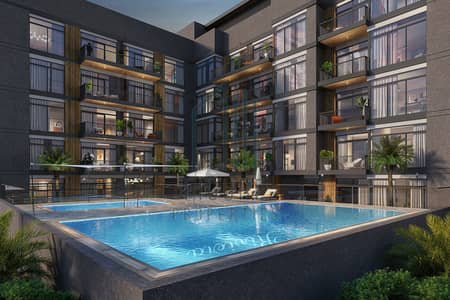 1 Спальня Апартамент Продажа в Джумейра Вилладж Серкл (ДЖВС), Дубай - Lodge-Exterior_Pool-Building-Night-1-scaled-1 (1). jpg