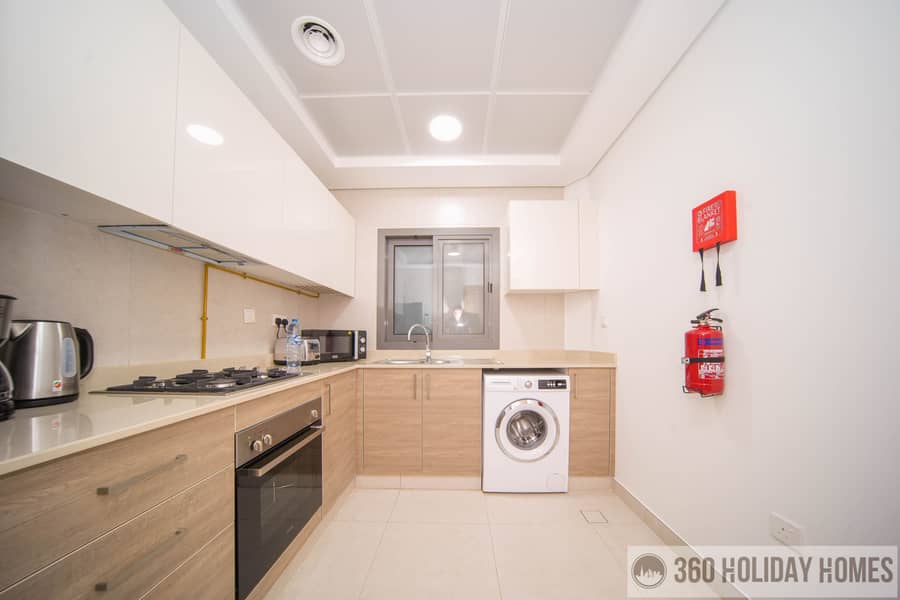 Chic 2BR with Balcony & Rooftop Pool Featuring Burj Khalifa Views