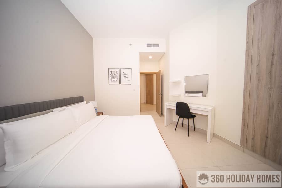 Chic 2BR with Balcony & Rooftop Pool Featuring Burj Khalifa Views