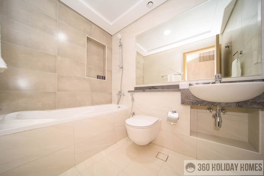 Chic 2BR with Balcony & Rooftop Pool Featuring Burj Khalifa Views - Image 8