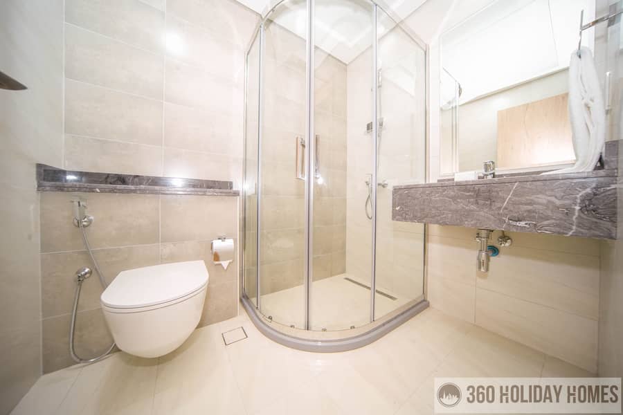 Chic 2BR with Balcony & Rooftop Pool Featuring Burj Khalifa Views - Image 9