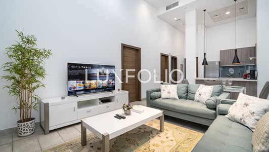 1 Bedroom Flat for Rent in Jumeirah Village Circle (JVC), Dubai - Luxury JVC 1BR + Maid’s Room Escape with Terrace