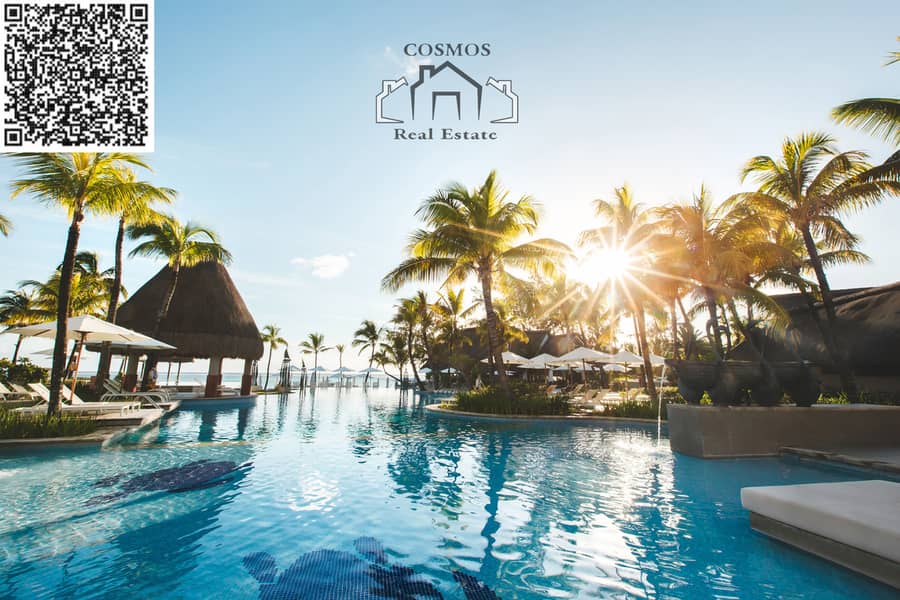 16 swimming-pool-among-palm-trees-on-a-tropical-islan-2022-02-12-05-47-40-utc. jpg