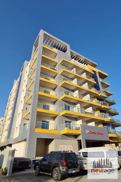فلیٹ 1 غرفة نوم للايجار في المدينة العالمية، دبي - belrlin-group-1-building. png