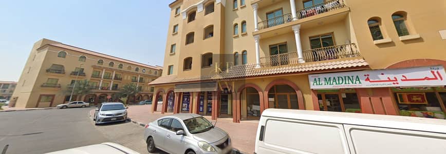 محل تجاري  للايجار في المدينة العالمية، دبي - S-Shop8. png