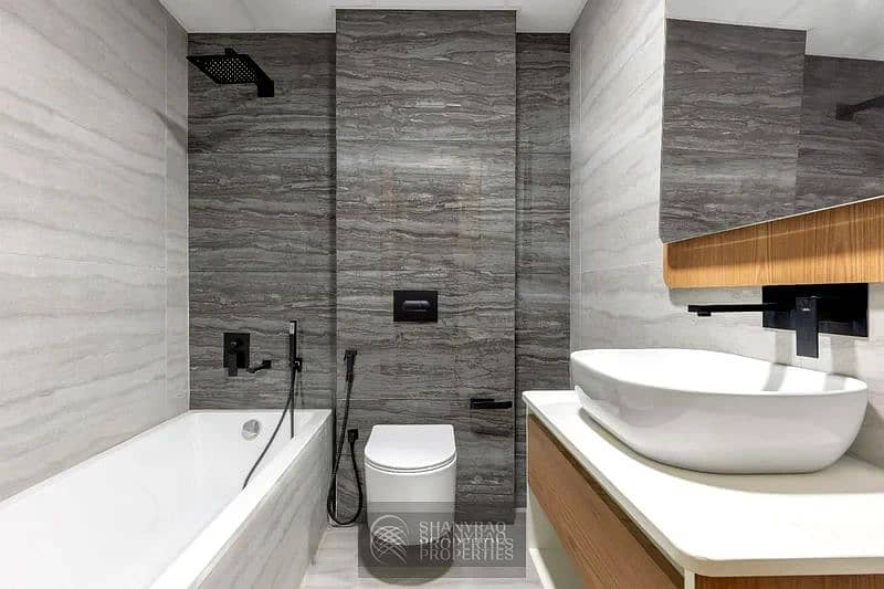 Live Elevated: Stunning High Floor Apartment in JVC with Pool & Burj Al Arab Views! - Image 24