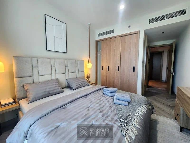 Live Elevated: Stunning High Floor Apartment in JVC with Pool & Burj Al Arab Views! - Image 8