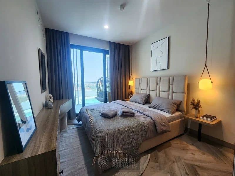 Live Elevated: Stunning High Floor Apartment in JVC with Pool & Burj Al Arab Views! - Image 10