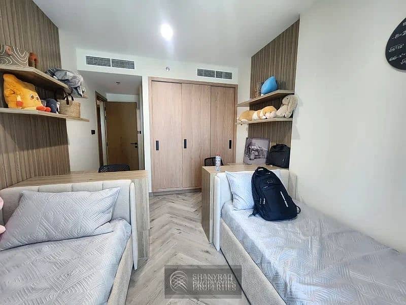 Live Elevated: Stunning High Floor Apartment in JVC with Pool & Burj Al Arab Views! - Image 13