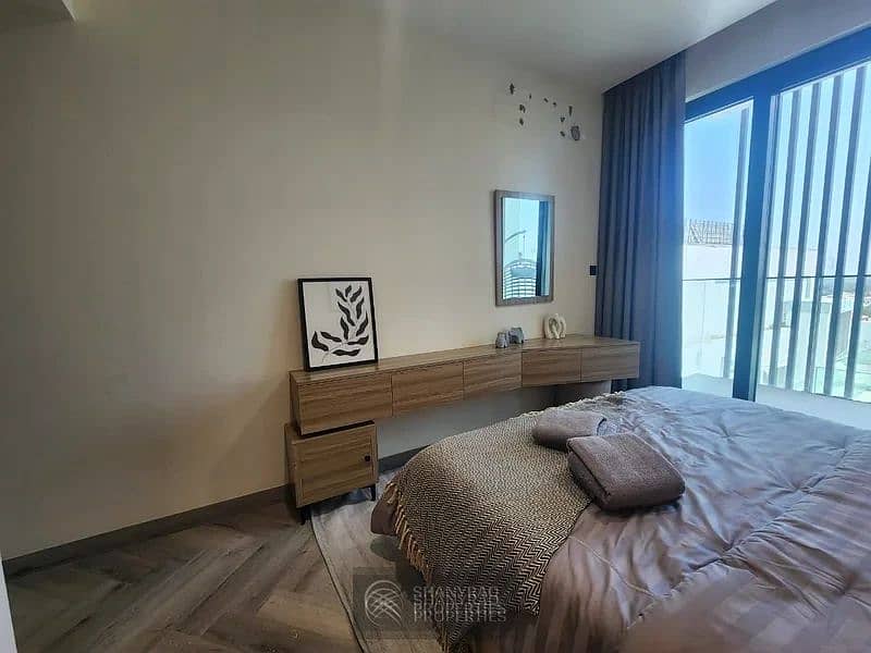 Live Elevated: Stunning High Floor Apartment in JVC with Pool & Burj Al Arab Views! - Image 11