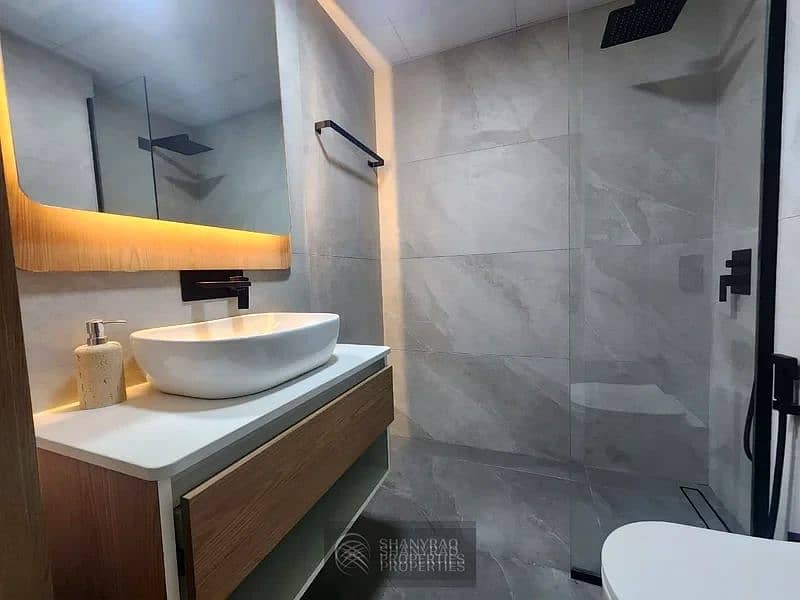 Live Elevated: Stunning High Floor Apartment in JVC with Pool & Burj Al Arab Views! - Image 22