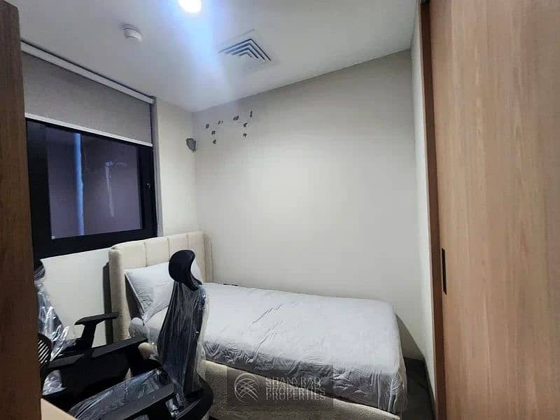 Live Elevated: Stunning High Floor Apartment in JVC with Pool & Burj Al Arab Views! - Image 15